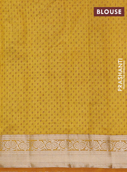 Semi raw silk saree mustard yellow with allover leaf prints and zari woven border