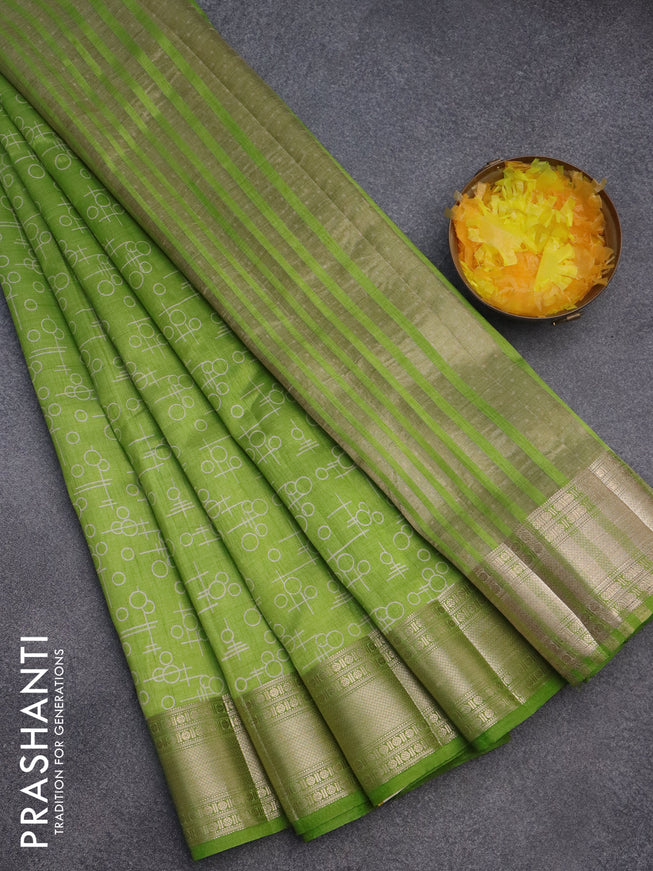 Semi raw silk saree light green with allover geometric prints and zari woven border