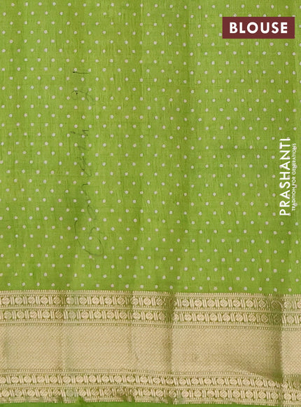 Semi raw silk saree light green with allover geometric prints and zari woven border