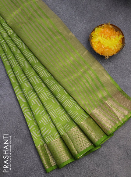 Semi raw silk saree light green with allover geometric prints and zari woven border