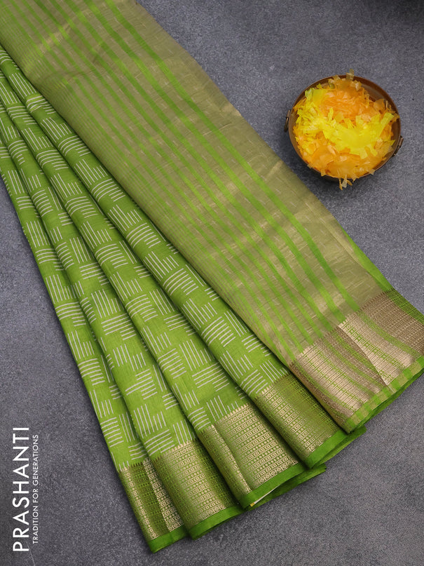 Semi raw silk saree light green with allover geometric prints and zari woven border