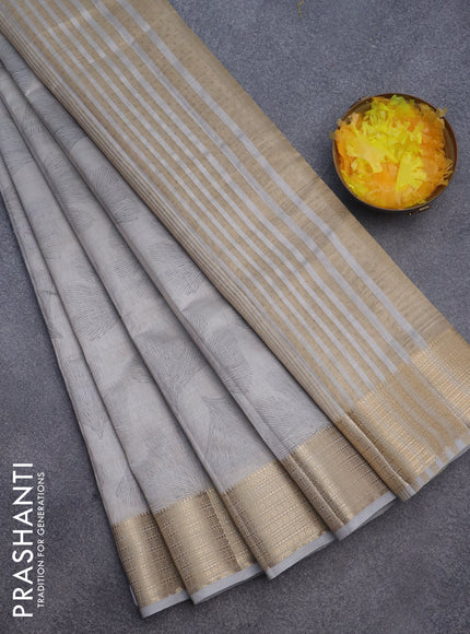 Semi raw silk saree pastel grey with butta prints and zari woven border