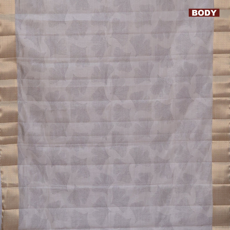 Semi raw silk saree pastel grey with butta prints and zari woven border