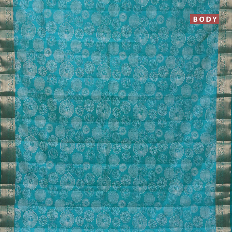 Semi raw silk saree teal blue with allover prints and zari woven border