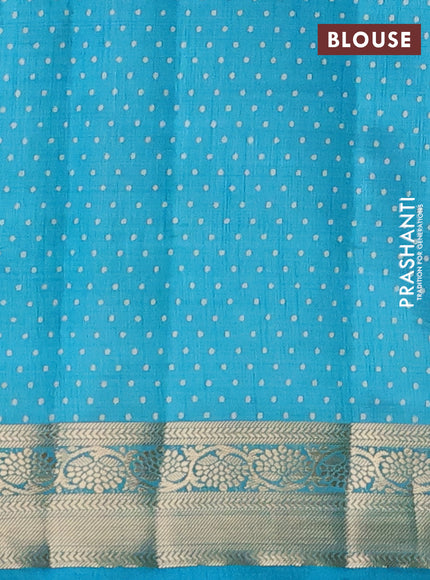 Semi raw silk saree teal blue with allover prints and zari woven border