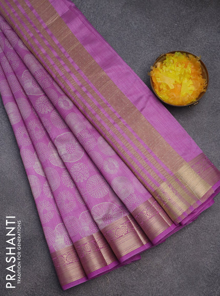 Semi raw silk saree lavender shade with allover prints and zari woven border