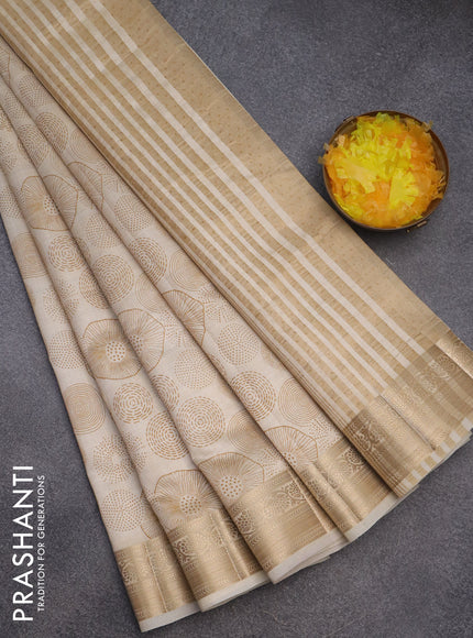 Semi raw silk saree cream with allover prints and zari woven border