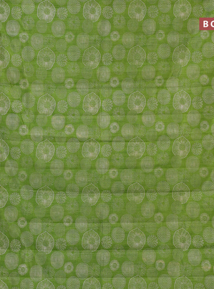 Semi raw silk saree light green with allover prints and zari woven border