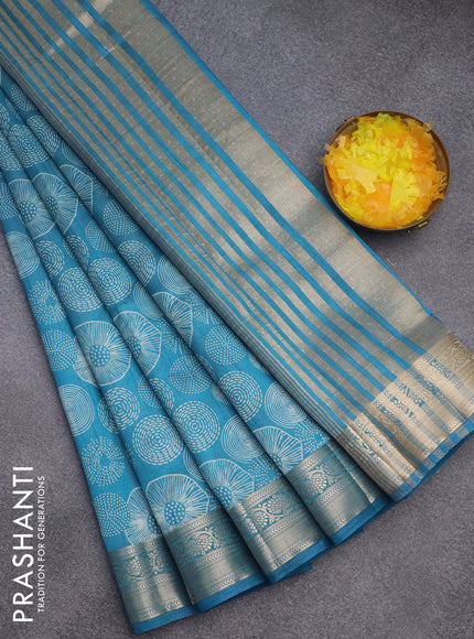 Semi raw silk saree cs blue with allover prints and zari woven border