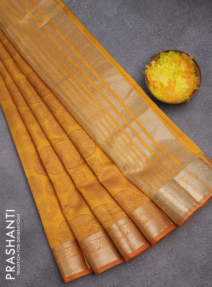 Semi raw silk saree mustard yellow with allover prints and zari woven border