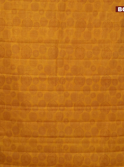 Semi raw silk saree mustard yellow with allover prints and zari woven border