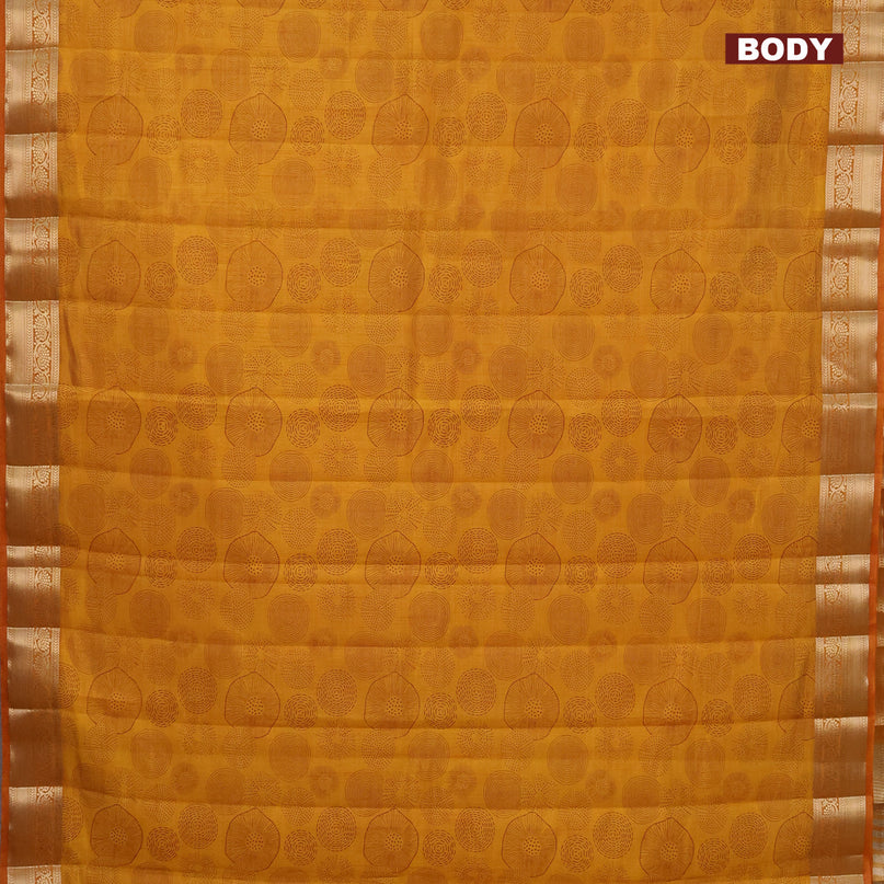 Semi raw silk saree mustard yellow with allover prints and zari woven border