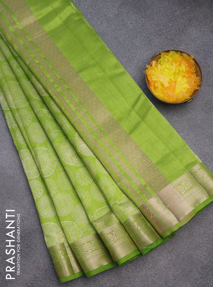 Semi raw silk saree light green with allover prints and zari woven border