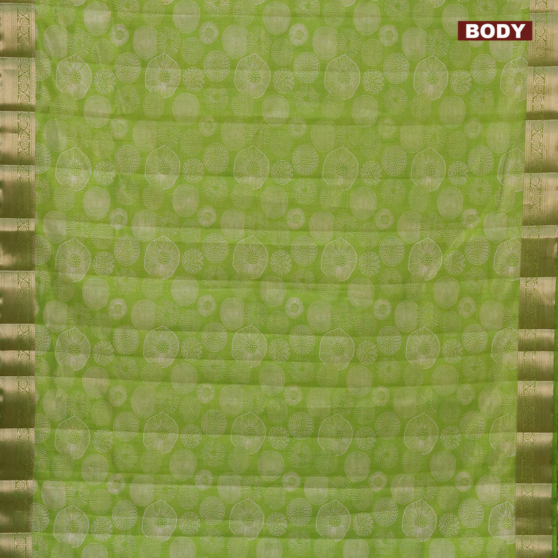 Semi raw silk saree light green with allover prints and zari woven border