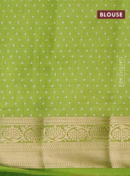 Semi raw silk saree light green with allover prints and zari woven border