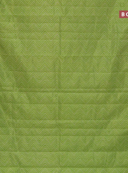 Semi raw silk saree light green with allover zig zag prints and zari woven border