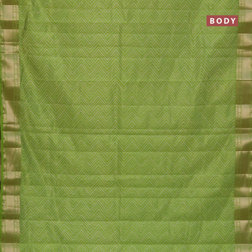 Semi raw silk saree light green with allover zig zag prints and zari woven border