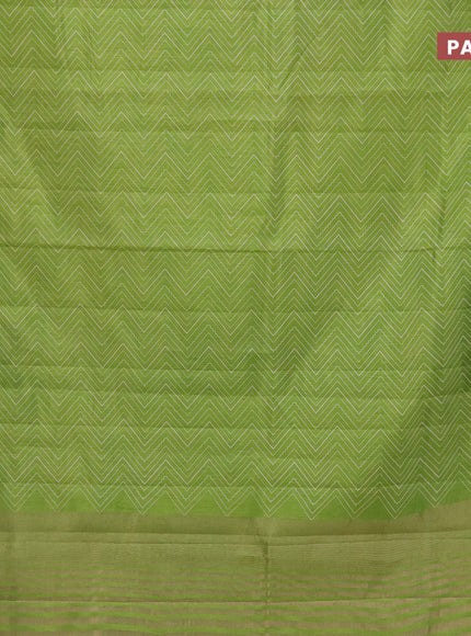 Semi raw silk saree light green with allover zig zag prints and zari woven border