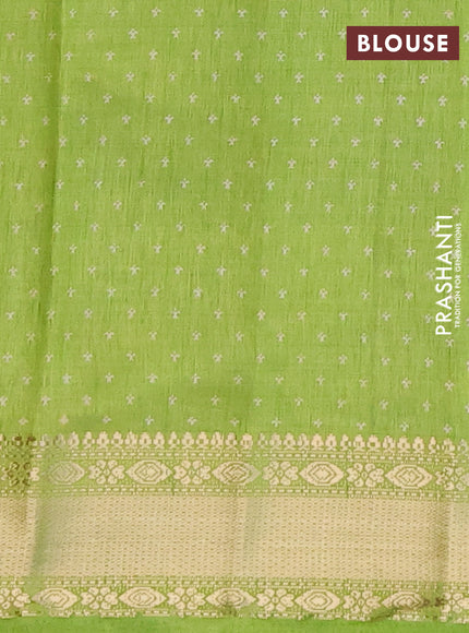 Semi raw silk saree light green with allover zig zag prints and zari woven border