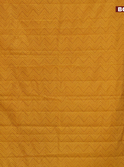 Semi raw silk saree mustard yellow with allover zig zag prints and zari woven border