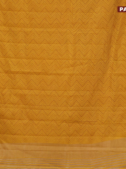 Semi raw silk saree mustard yellow with allover zig zag prints and zari woven border