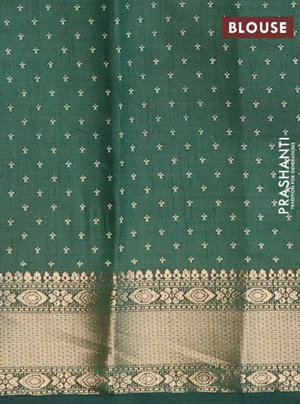 Semi raw silk saree green with allover zig zag prints and zari woven border