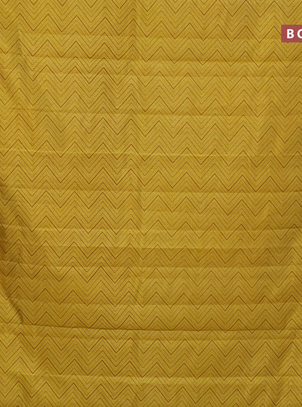 Semi raw silk saree yellow with allover zig zag prints and zari woven border