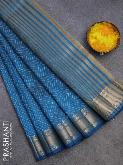 Semi raw silk saree cs blue with allover zig zag prints and zari woven border