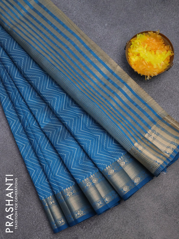 Semi raw silk saree cs blue with allover zig zag prints and zari woven border