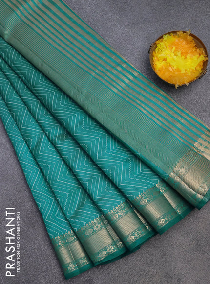 Semi raw silk saree teal blue with allover zig zag prints and zari woven border