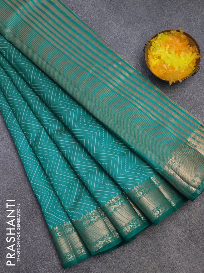 Semi raw silk saree teal blue with allover zig zag prints and zari woven border