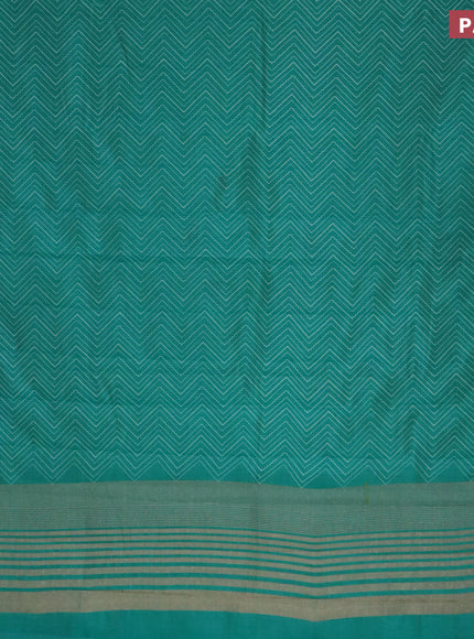 Semi raw silk saree teal blue with allover zig zag prints and zari woven border