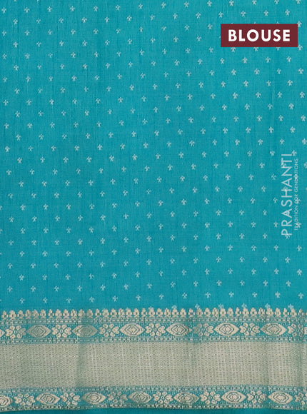 Semi raw silk saree teal blue with allover zig zag prints and zari woven border