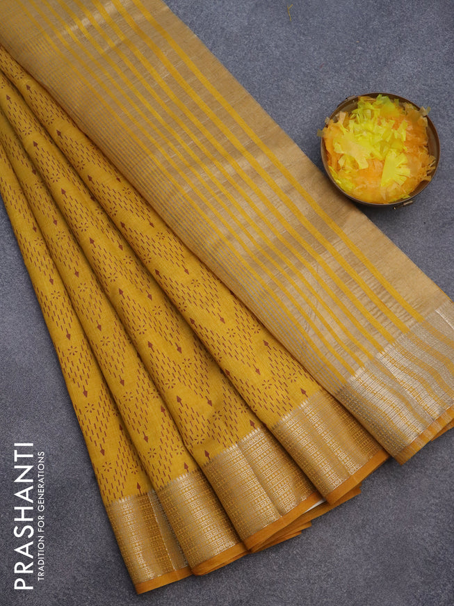 Semi raw silk saree mustard yellow with allover prints and zari woven border