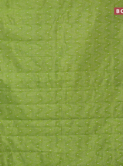 Semi raw silk saree light green with allover prints and zari woven border