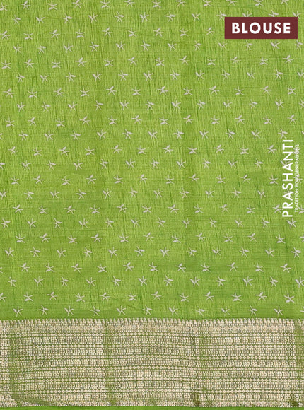 Semi raw silk saree light green with allover prints and zari woven border