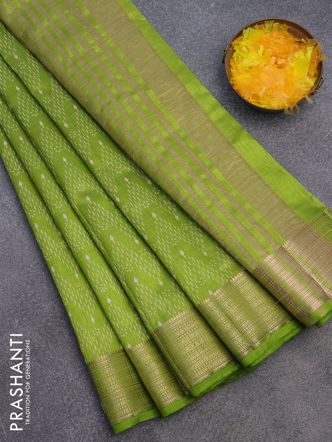 Semi raw silk saree light green with allover prints and zari woven border