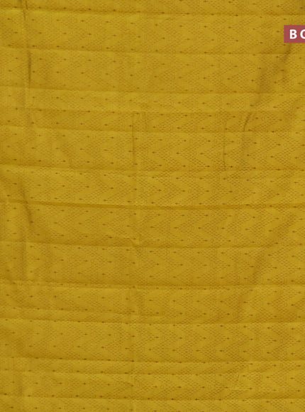 Semi raw silk saree yellow with allover prints and zari woven border