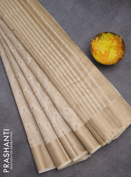 Semi raw silk saree cream with allover prints and zari woven border