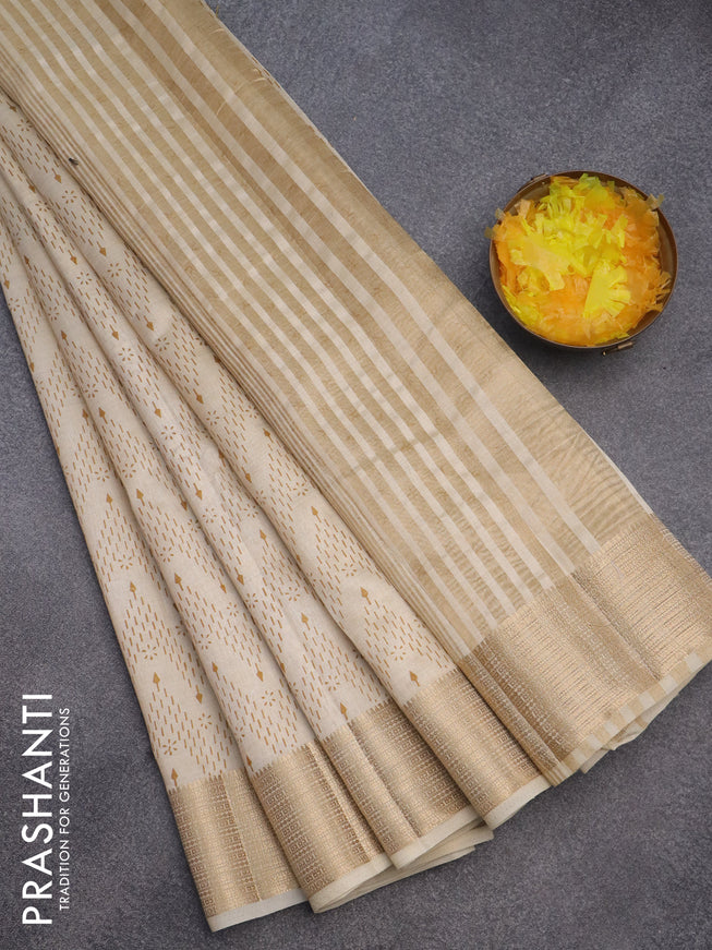 Semi raw silk saree cream with allover prints and zari woven border