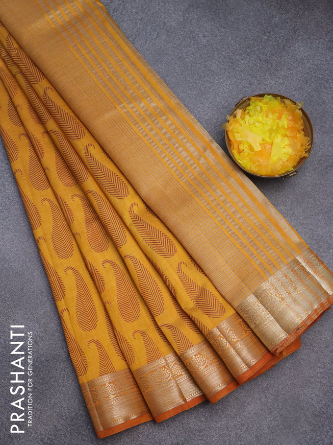 Semi raw silk saree dark mustard with paisley butta prints and zari woven border