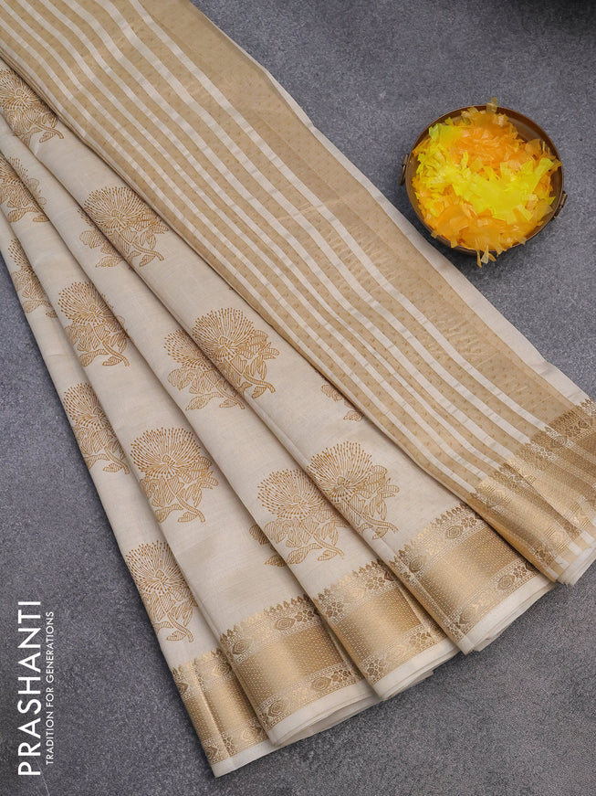 Semi raw silk saree cream with floral butta prints and zari woven border