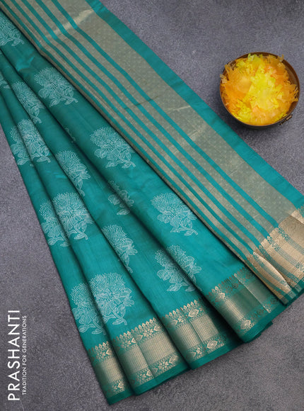 Semi raw silk saree teal blue with floral butta prints and zari woven border