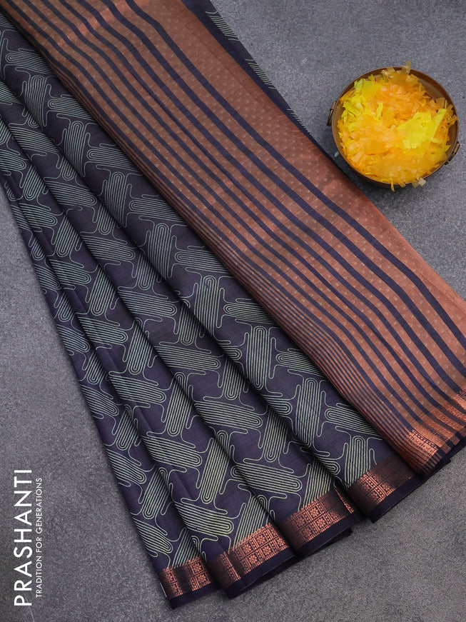 Semi raw silk saree navy blue with allover prints and copper zari woven border