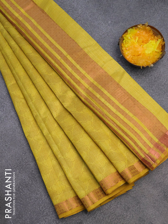 Semi raw silk saree yellow with allover prints and copper zari woven border