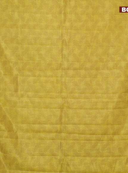 Semi raw silk saree yellow with allover prints and copper zari woven border