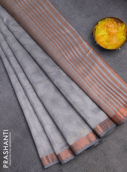 Semi raw silk saree grey with allover prints and copper zari woven border