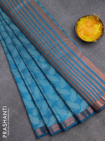 Semi raw silk saree blue with allover prints and copper zari woven border