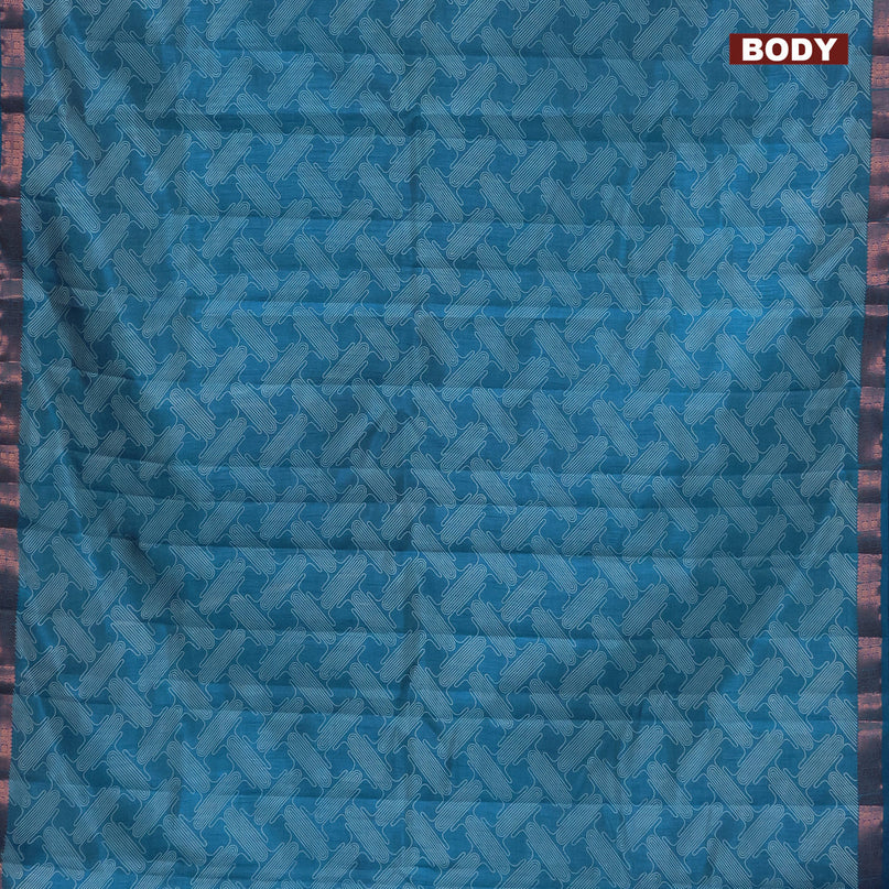 Semi raw silk saree blue with allover prints and copper zari woven border