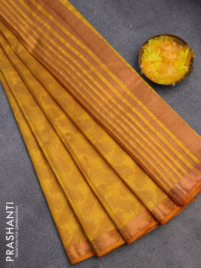 Semi raw silk saree mustard yellow with allover prints and copper zari woven border